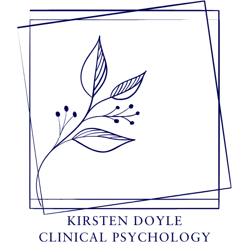 Image of Kirsten Doyle before a bookcase